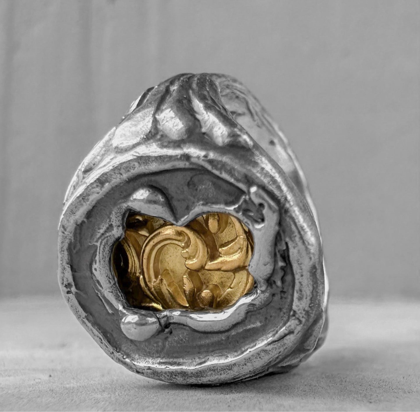 Heritage Ring - unusual signet ring made of sterling silver with a texture of melted metal, gilded patterns and antique motifs. Unusual rings project50g