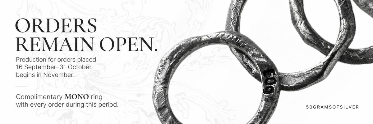 Promotional graphic with the text 'ORDERS REMAIN OPEN.' and order details, alongside a close-up of a textured silver ring on a white background.