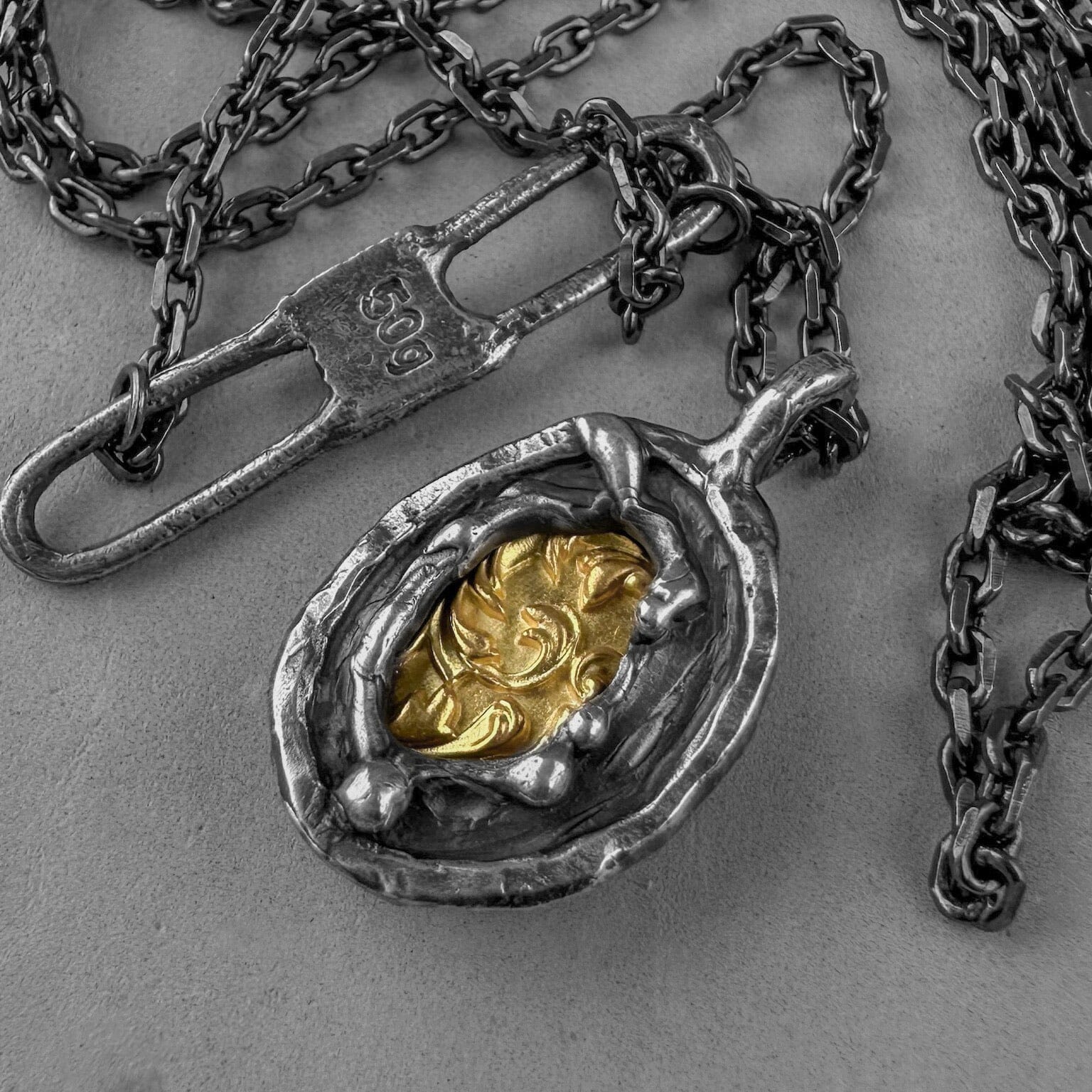 Heritage pendant - unusual pendant with chain made of sterling silver with a texture of melted metal, gilded patterns and antique motifs. Charms & Pendants project50g 