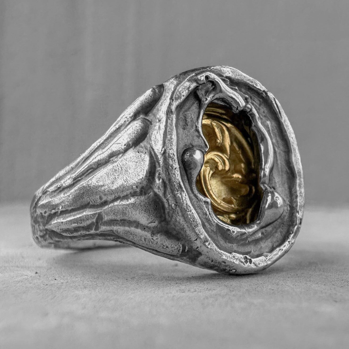 Heritage Ring - unusual signet ring made of sterling silver with a texture of melted metal, gilded patterns and antique motifs. Unusual rings project50g 