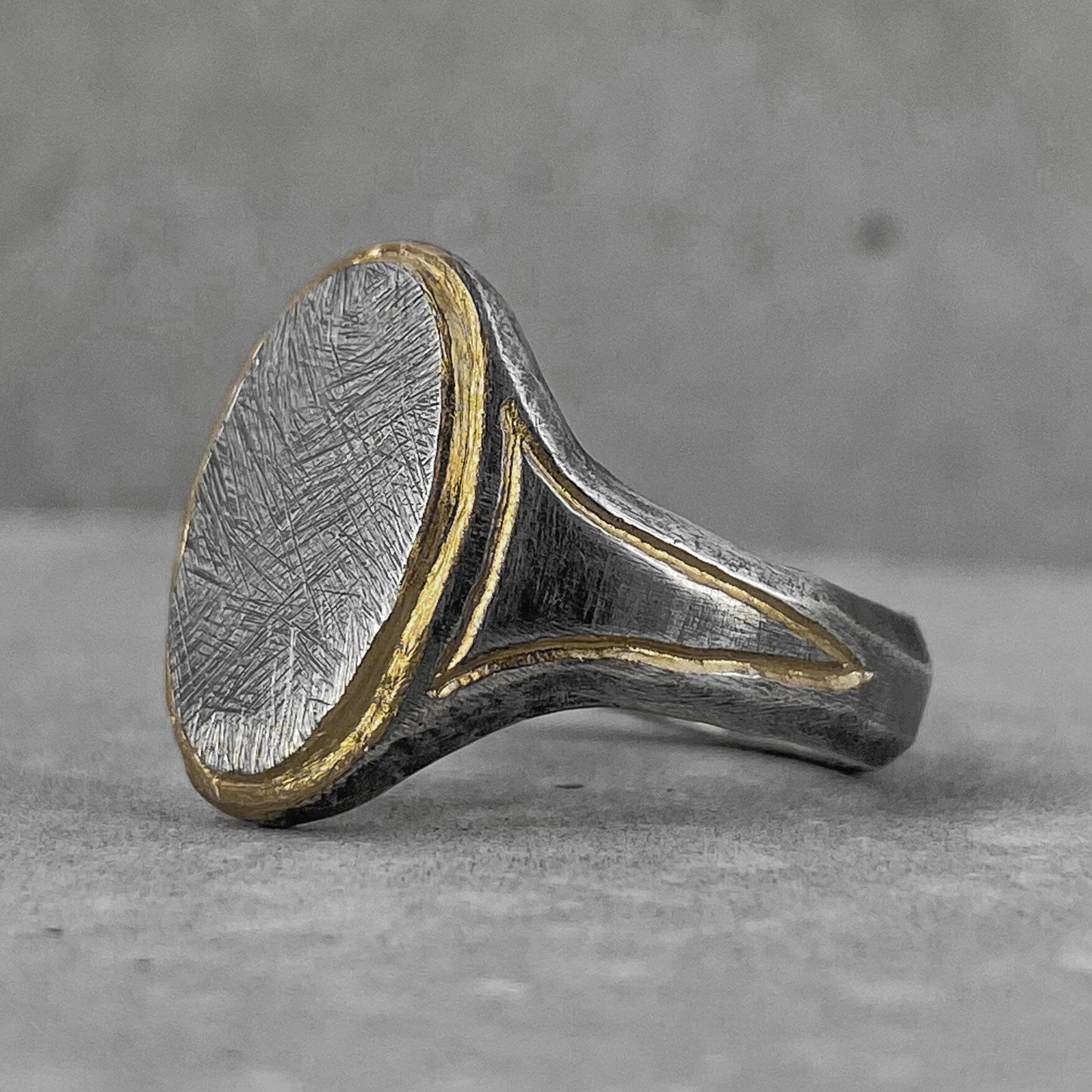 Oval ring- Elegant oval ring with gold plated elements and scratched texture Rings with smooth texture Project50g 