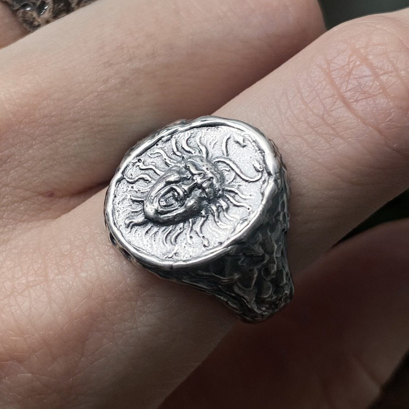 The Medusa ring is an oval signet ring with an unusual fused texture and a portrait of the Gorgon Medusa Unusual rings Project50g 