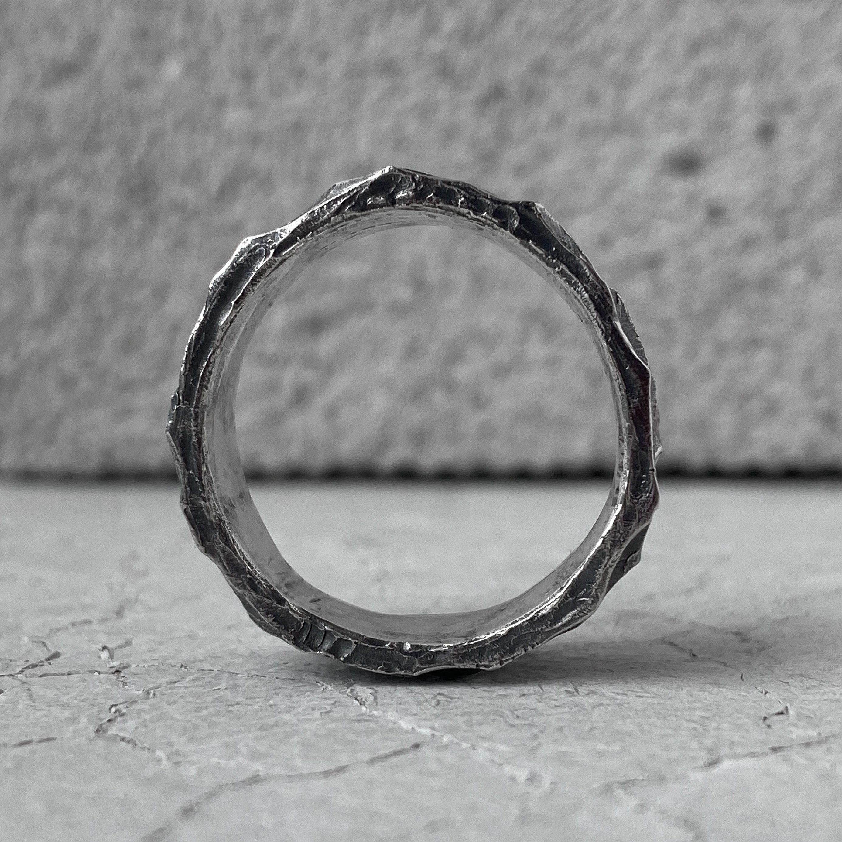 WAVE ring- wide band ring annular strip with a texture resembling surging  waves on the surface